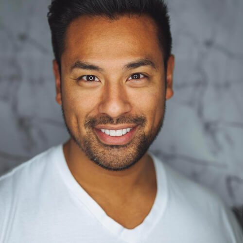  close up photo smiling man with white top